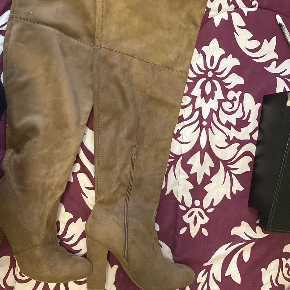 High thigh boots tan color with heel.